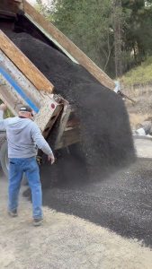 Original Spreading crashed asphalt over the dirt road_ #popular #construction #road #truck #short￼