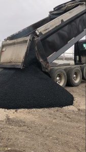 Truck dumping asphalt part 2